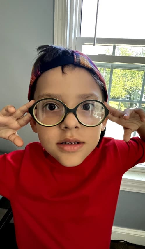 Kid with oversized glasses