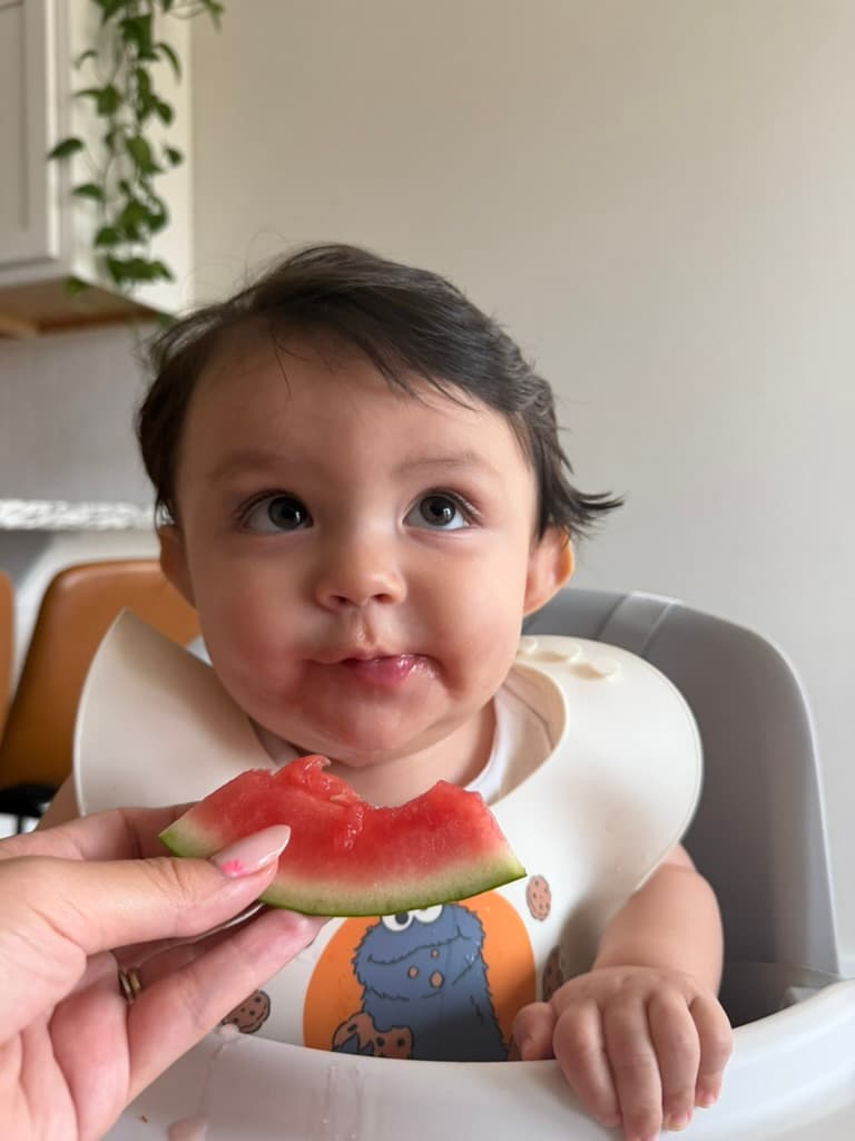 Baby eating watermelon
